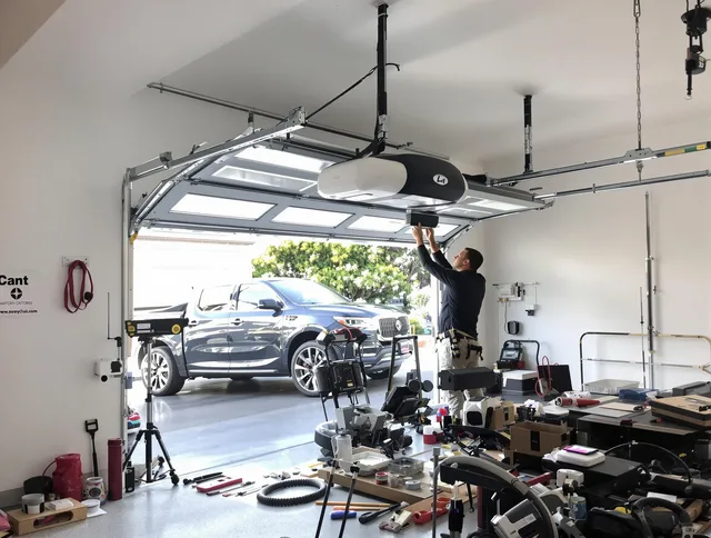 Vernon Garage Door Repair specialist installing smart garage door opener system in Vernon home