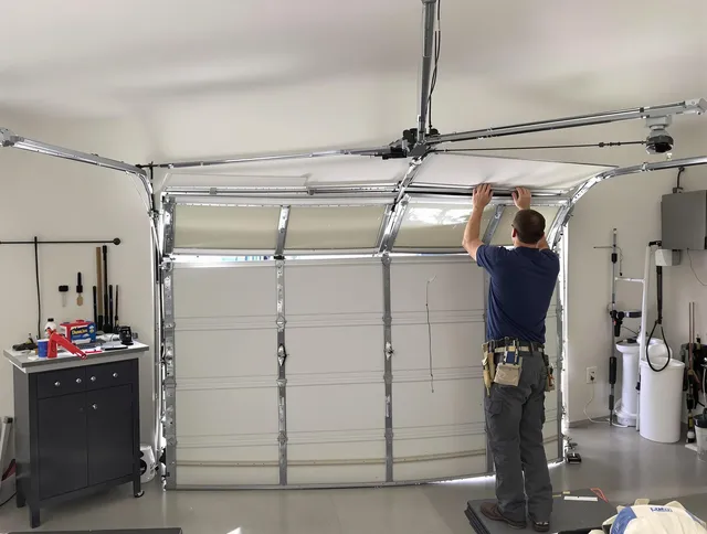 Vernon Garage Door Repair specialist performing precise section replacement on Vernon garage door